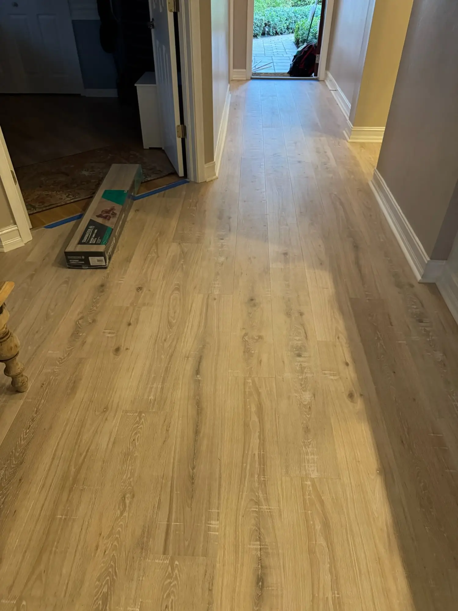 Light oak plank through an open floor plan