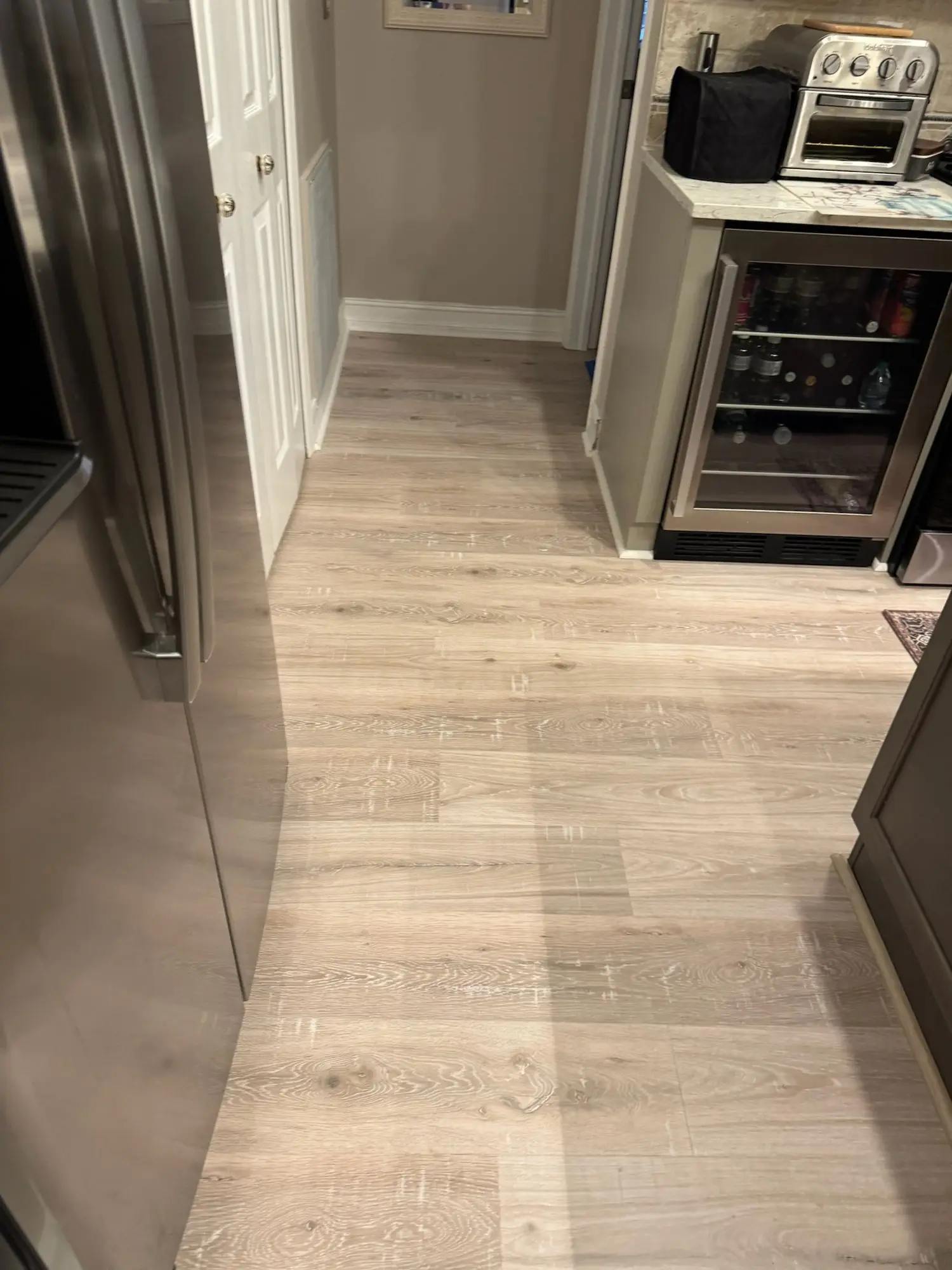 Light oak plank through an open floor plan