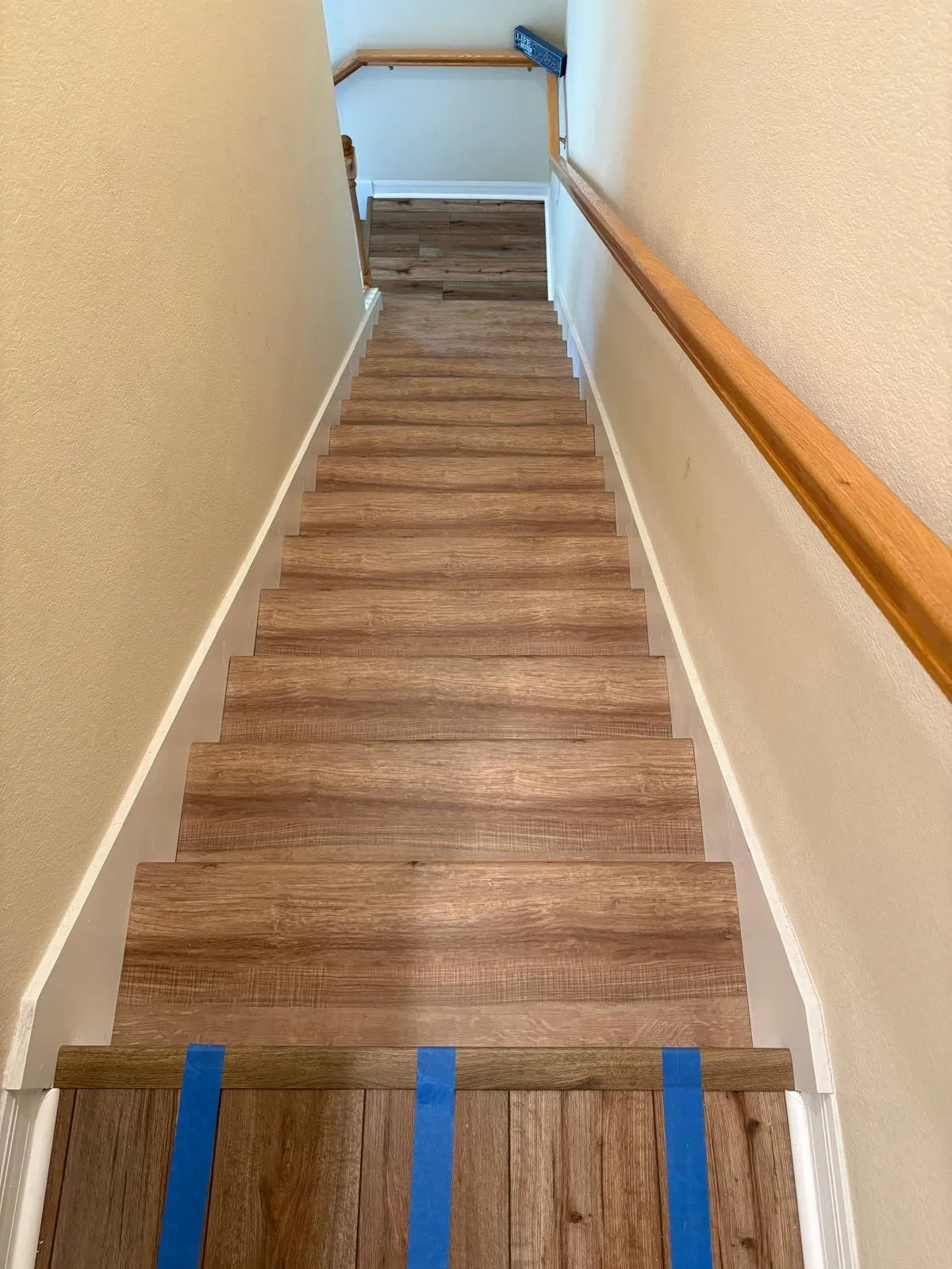 Treads taped while the adhesive cures